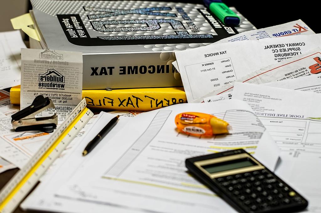 Calculator and pen on financial statement